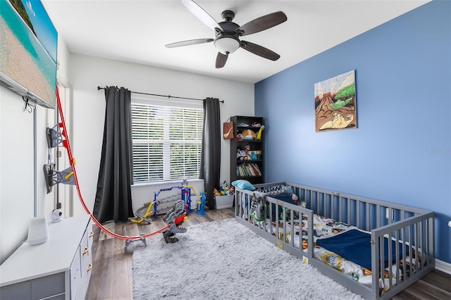 171 Mcleods Way, Winter Springs, FL 32708 - bedroom featuring wood finished floors, a crib, and ceiling fan