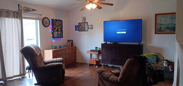 interior space with a ceiling fan and wood finished floors
