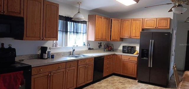 kitchen with a sink, a ceiling fan, black appliances, and brown cabinets