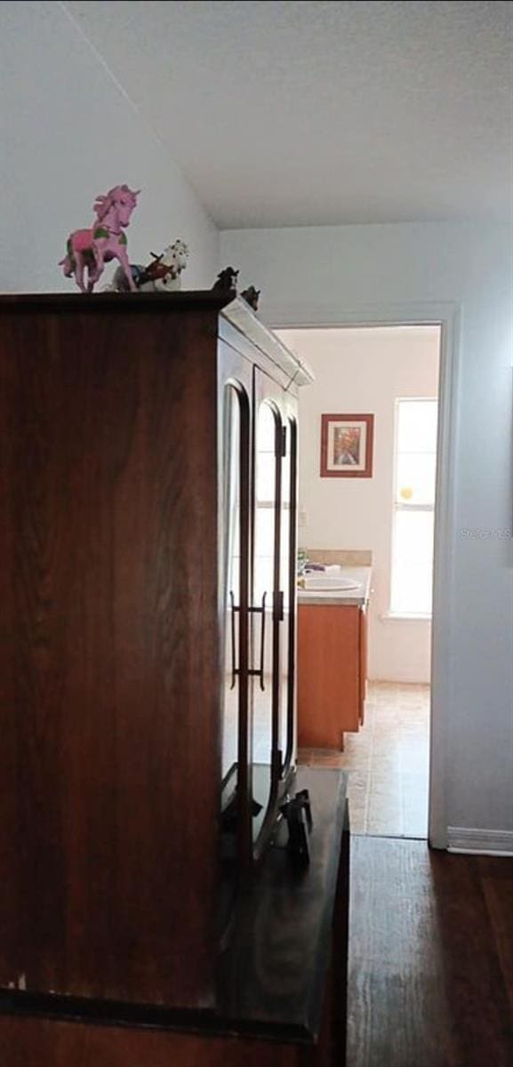 corridor with wood finished floors