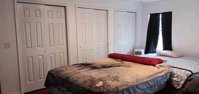 bedroom featuring multiple closets