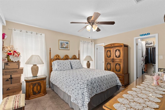 bedroom with a ceiling fan and light carpet