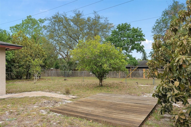 view of yard featuring a fenced backyard and a deck