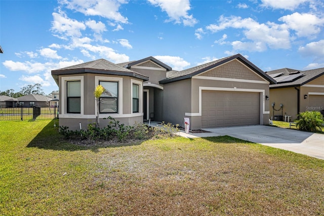 4601 Talbot Blvd, Cocoa, FL 32926 - view of front facade with fence, stucco siding, concrete driveway, and a garage
