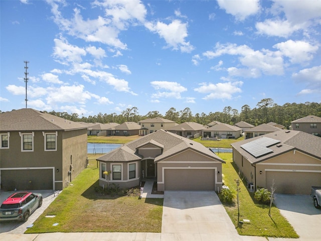 4601 Talbot Blvd, Cocoa, FL 32926 - traditional home with a residential view, an attached garage, stucco siding, a front yard, and driveway