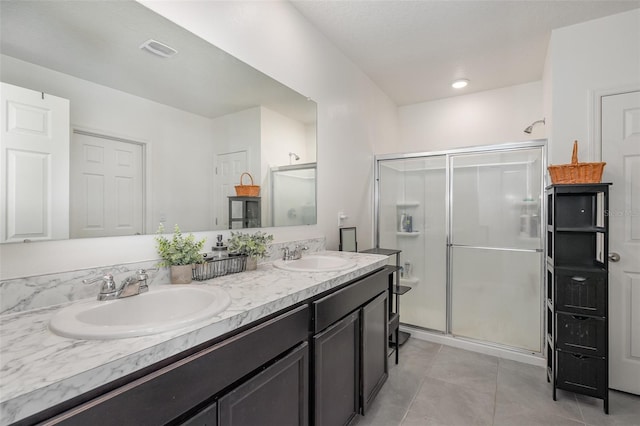 4601 Talbot Blvd, Cocoa, FL 32926 - bathroom featuring a sink, tile patterned flooring, and a stall shower