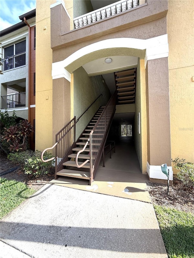 view of exterior entry featuring stucco siding