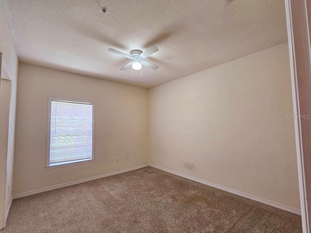 3577 Conroy Rd Unit 331, Orlando, FL 32839 - carpeted spare room featuring baseboards, a ceiling fan, and a textured ceiling
