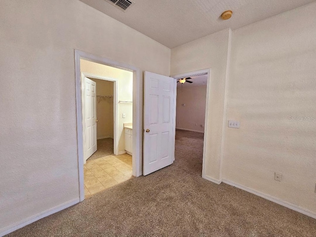 3577 Conroy Rd Unit 331, Orlando, FL 32839 - empty room with baseboards, visible vents, light carpet, and ceiling fan