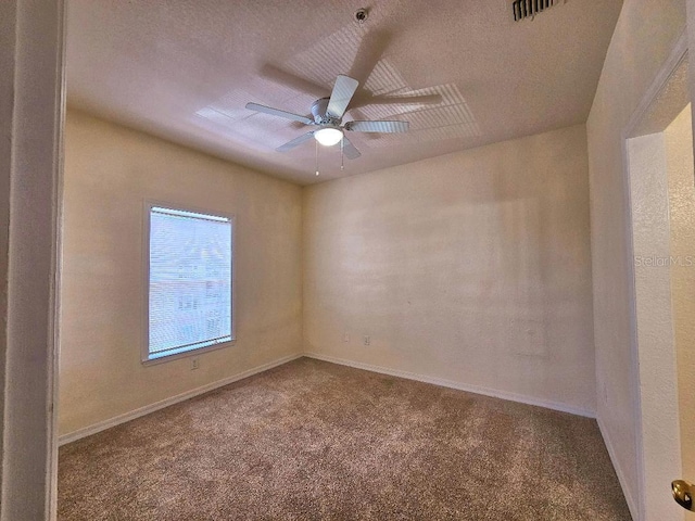3577 Conroy Rd Unit 331, Orlando, FL 32839 - spare room with baseboards, ceiling fan, carpet flooring, and a textured ceiling