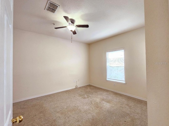 3577 Conroy Rd Unit 331, Orlando, FL 32839 - empty room with visible vents, a ceiling fan, baseboards, a textured ceiling, and carpet flooring