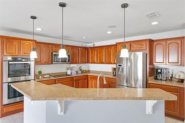 2806 Polson Dr, Kissimmee, FL 34758 - kitchen with appliances with stainless steel finishes, light countertops, light tile patterned floors, a sink, and recessed lighting