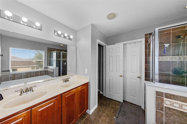 2806 Polson Dr, Kissimmee, FL 34758 - bathroom featuring a shower stall, tile patterned floors, double vanity, and a garden tub