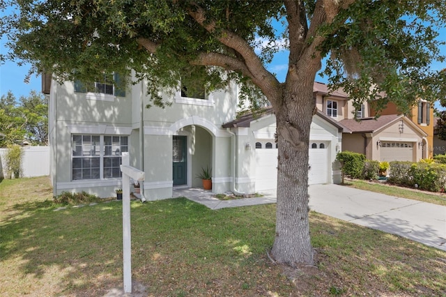 2806 Polson Dr, Kissimmee, FL 34758 - view of front facade with a garage, driveway, and stucco siding