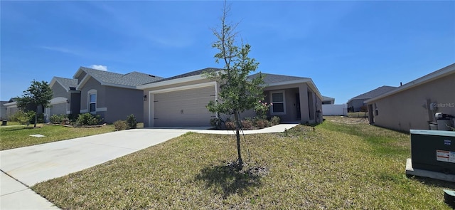 ranch-style home with an attached garage, a front lawn, stucco siding, and driveway