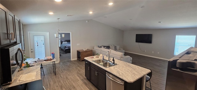 kitchen with a sink, light countertops, dark wood-style floors, and open floor plan