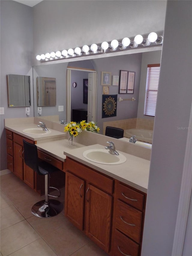 bathroom featuring tile patterned flooring and vanity