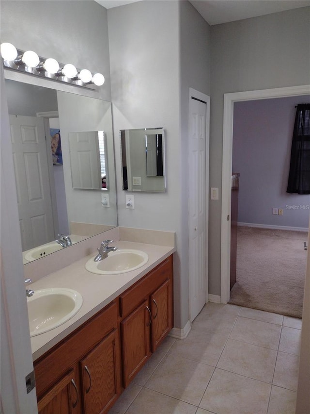 bathroom featuring a sink, tile patterned flooring, and double vanity