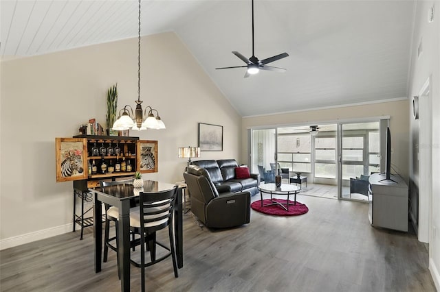 1136 Villa Ln Unit 96, Apopka, FL 32712 - living area with a dry bar, wood finished floors, baseboards, high vaulted ceiling, and ceiling fan with notable chandelier