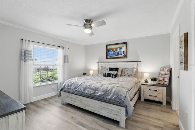 1136 Villa Ln Unit 96, Apopka, FL 32712 - bedroom with ceiling fan, baseboards, ornamental molding, and wood finished floors
