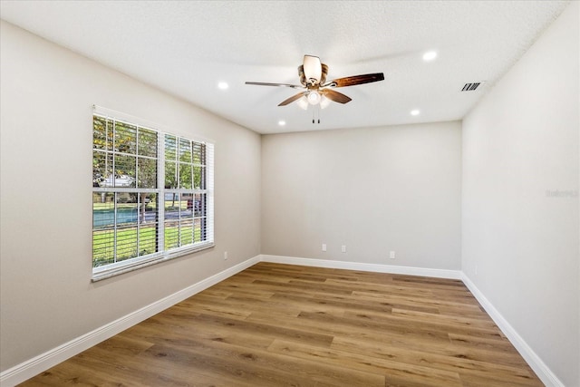 5162 Tellson Pl, Orlando, FL 32812 - unfurnished room with recessed lighting, a ceiling fan, wood finished floors, and visible vents