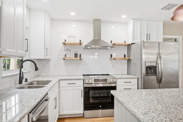 5162 Tellson Pl, Orlando, FL 32812 - kitchen with a sink, appliances with stainless steel finishes, open shelves, and wall chimney range hood