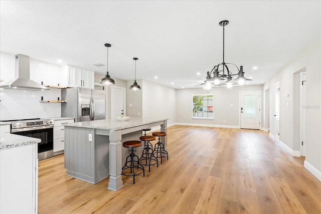 5162 Tellson Pl, Orlando, FL 32812 - kitchen featuring white cabinets, open shelves, extractor fan, stainless steel appliances, and decorative backsplash