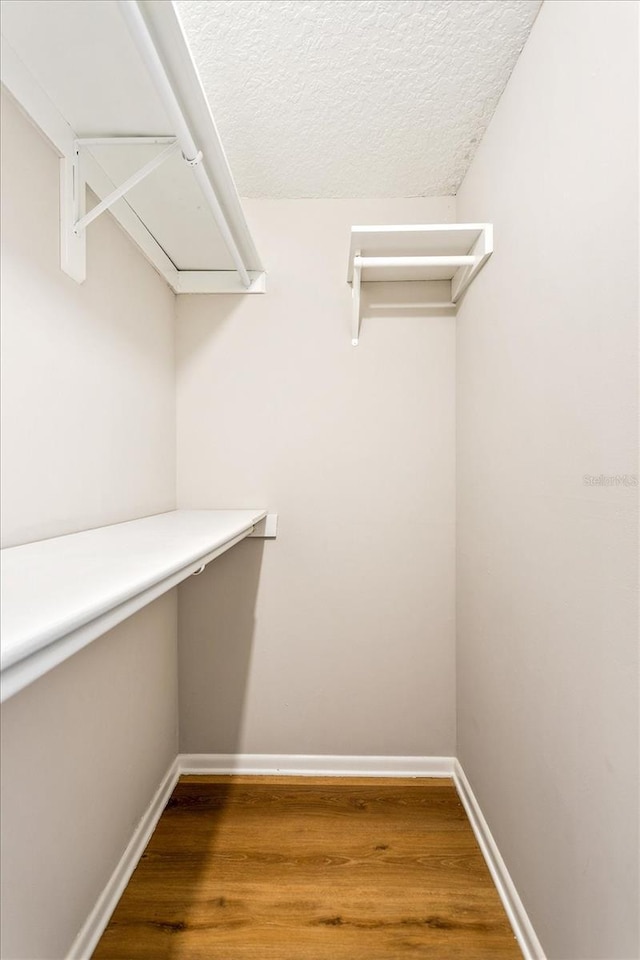 5162 Tellson Pl, Orlando, FL 32812 - spacious closet with built in study area and wood finished floors