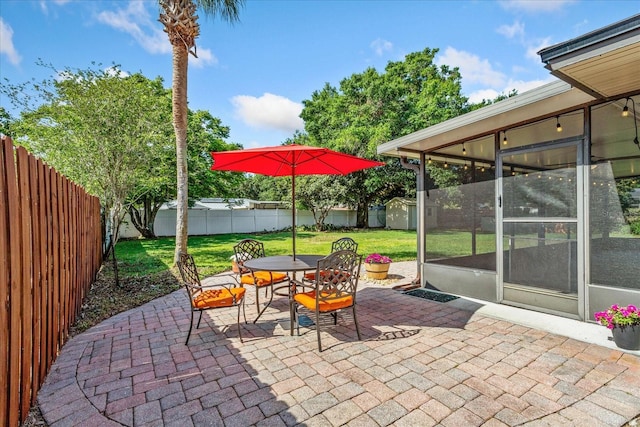 5162 Tellson Pl, Orlando, FL 32812 - view of patio / terrace with outdoor dining area, a fenced backyard, a storage unit, a sunroom, and an outbuilding