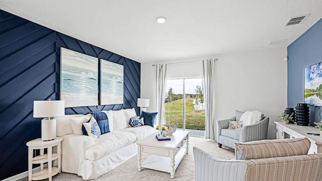 carpeted living room with visible vents