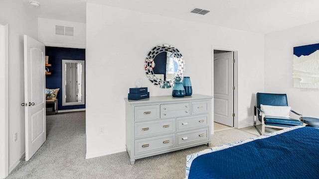 bedroom featuring baseboards, light carpet, and visible vents
