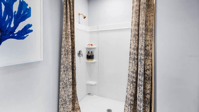 full bathroom featuring a stall shower