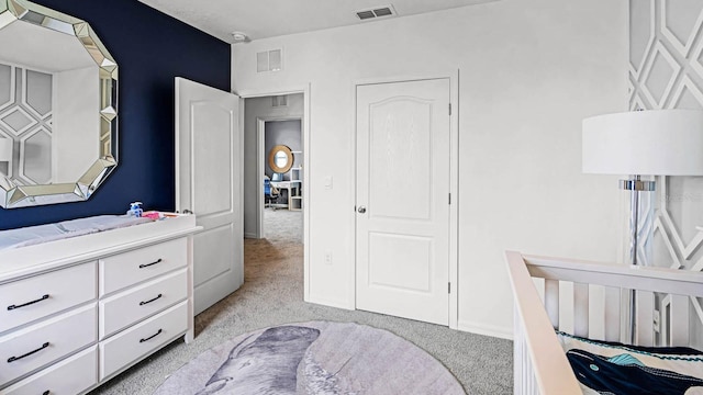 bedroom with light colored carpet and visible vents