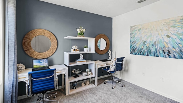 carpeted office featuring baseboards and visible vents