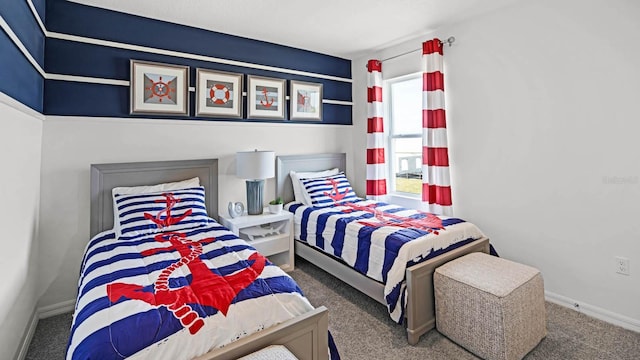 carpeted bedroom with baseboards