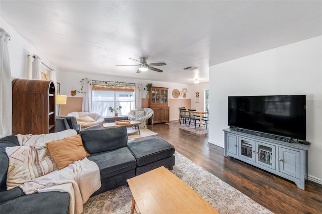 8619 Veridian Dr, Orlando, FL 32810 - living room featuring dark wood-style flooring, a ceiling fan, and visible vents