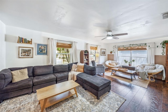 8619 Veridian Dr, Orlando, FL 32810 - living area with a ceiling fan and dark wood-type flooring