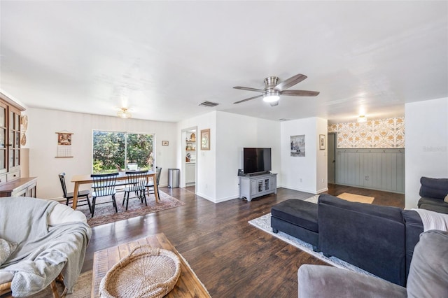 8619 Veridian Dr, Orlando, FL 32810 - living room featuring a ceiling fan, visible vents, wainscoting, wood finished floors, and baseboards