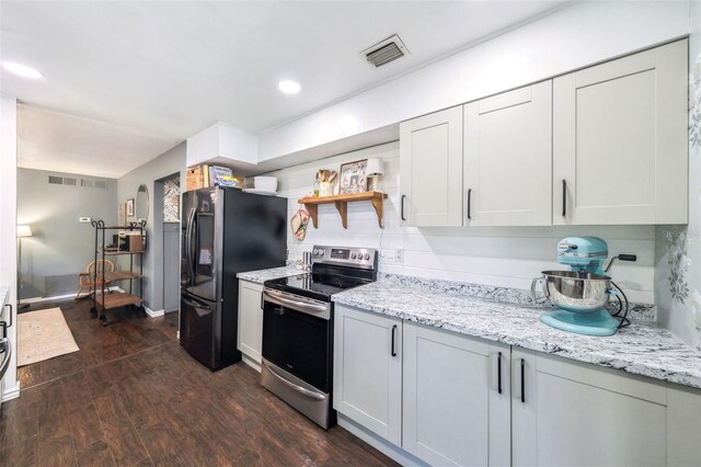 8619 Veridian Dr, Orlando, FL 32810 - kitchen with visible vents, freestanding refrigerator, open shelves, stainless steel electric range, and dark wood finished floors