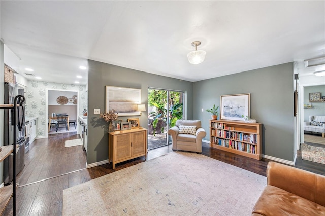 8619 Veridian Dr, Orlando, FL 32810 - sitting room featuring baseboards and dark wood finished floors
