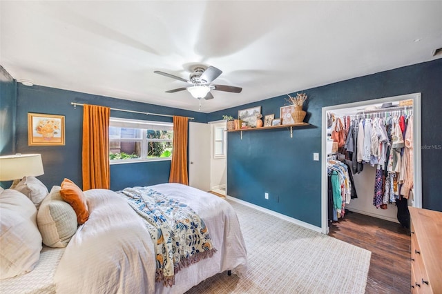 8619 Veridian Dr, Orlando, FL 32810 - bedroom featuring a ceiling fan, wood finished floors, baseboards, a closet, and a spacious closet