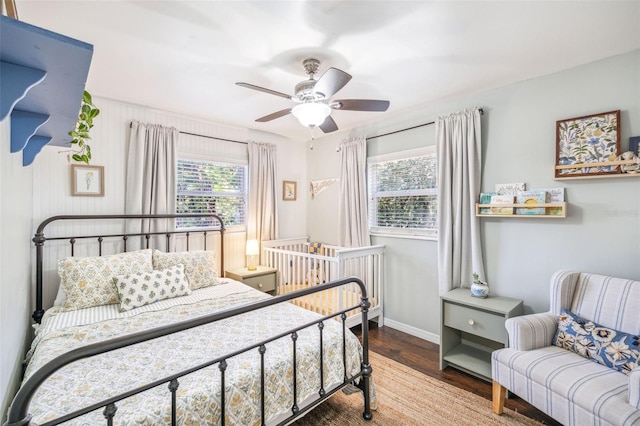 8619 Veridian Dr, Orlando, FL 32810 - bedroom with baseboards, ceiling fan, and wood finished floors