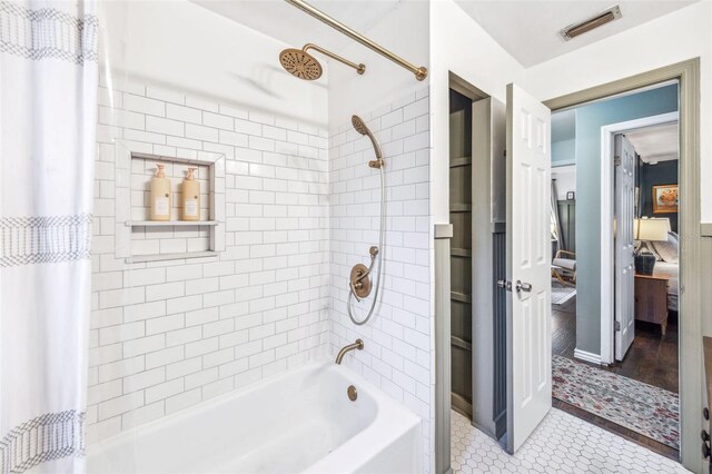 8619 Veridian Dr, Orlando, FL 32810 - full bath with shower / bathtub combination, visible vents, and tile patterned flooring