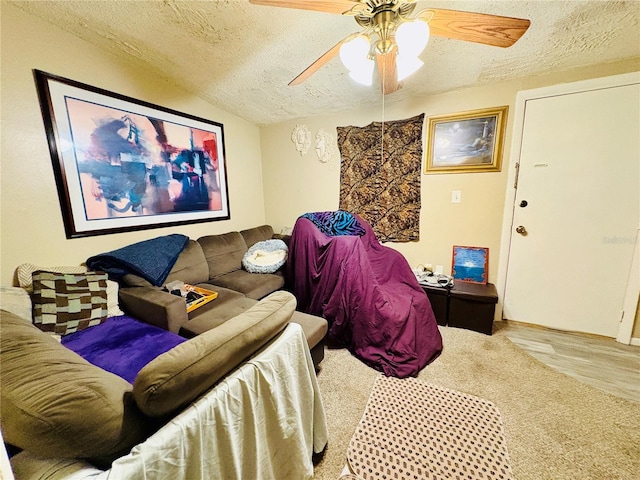 116 Lincoln Ave Unit 116-118, Cape Canaveral, FL 32920 - living room featuring a textured ceiling, a ceiling fan, wood finished floors, and vaulted ceiling
