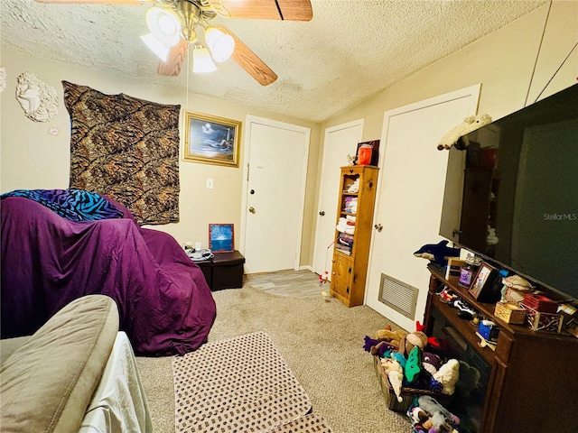 116 Lincoln Ave Unit 116-118, Cape Canaveral, FL 32920 - bedroom featuring a textured ceiling, vaulted ceiling, ceiling fan, and carpet