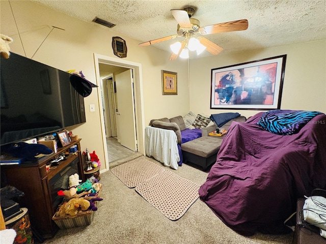 116 Lincoln Ave Unit 116-118, Cape Canaveral, FL 32920 - carpeted bedroom with a textured ceiling and a ceiling fan