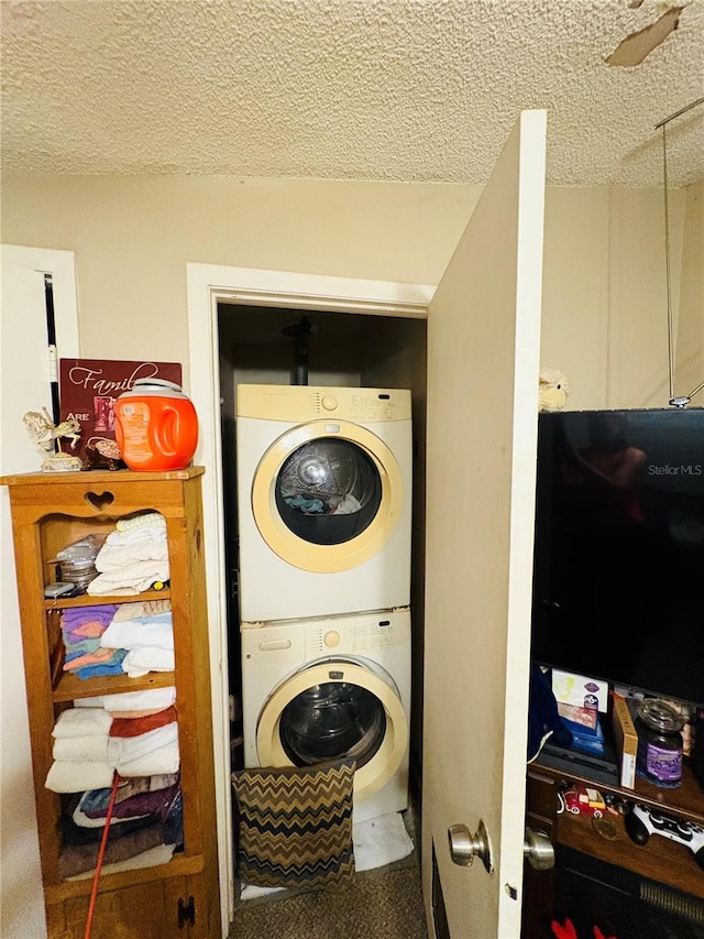 116 Lincoln Ave Unit 116-118, Cape Canaveral, FL 32920 - washroom featuring estacked washer and dryer and a textured ceiling