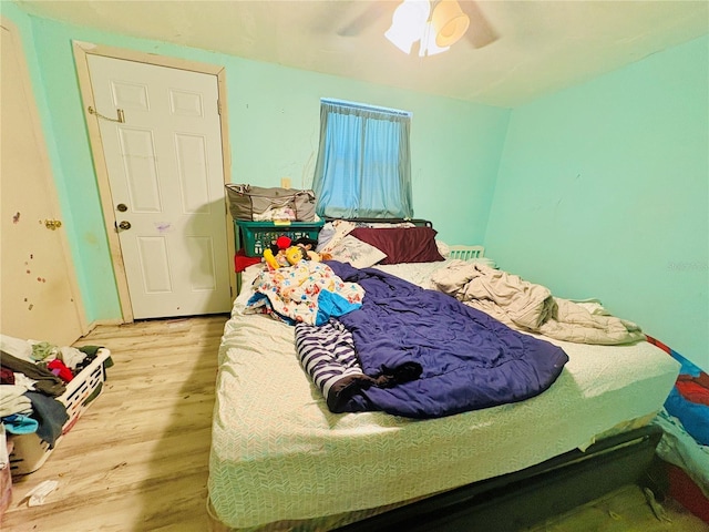 116 Lincoln Ave Unit 116-118, Cape Canaveral, FL 32920 - bedroom featuring light wood finished floors and a ceiling fan