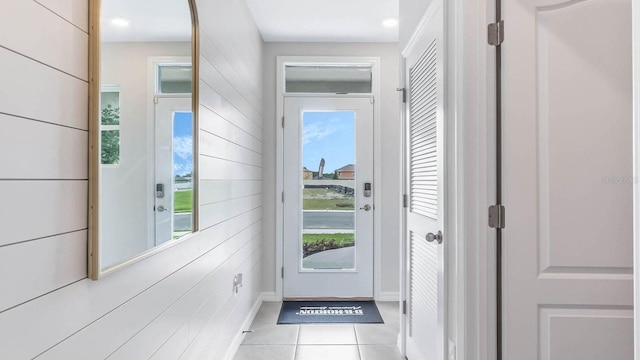doorway to outside with recessed lighting and light tile patterned floors