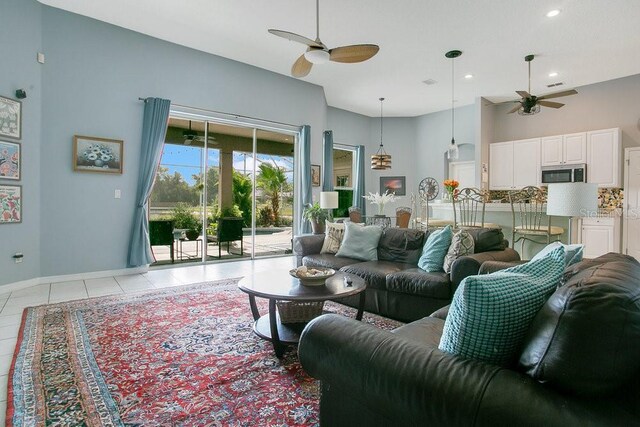 4219 Lillian Hall Ln, Orlando, FL 32812 - living room with baseboards, ceiling fan, recessed lighting, and light tile patterned flooring